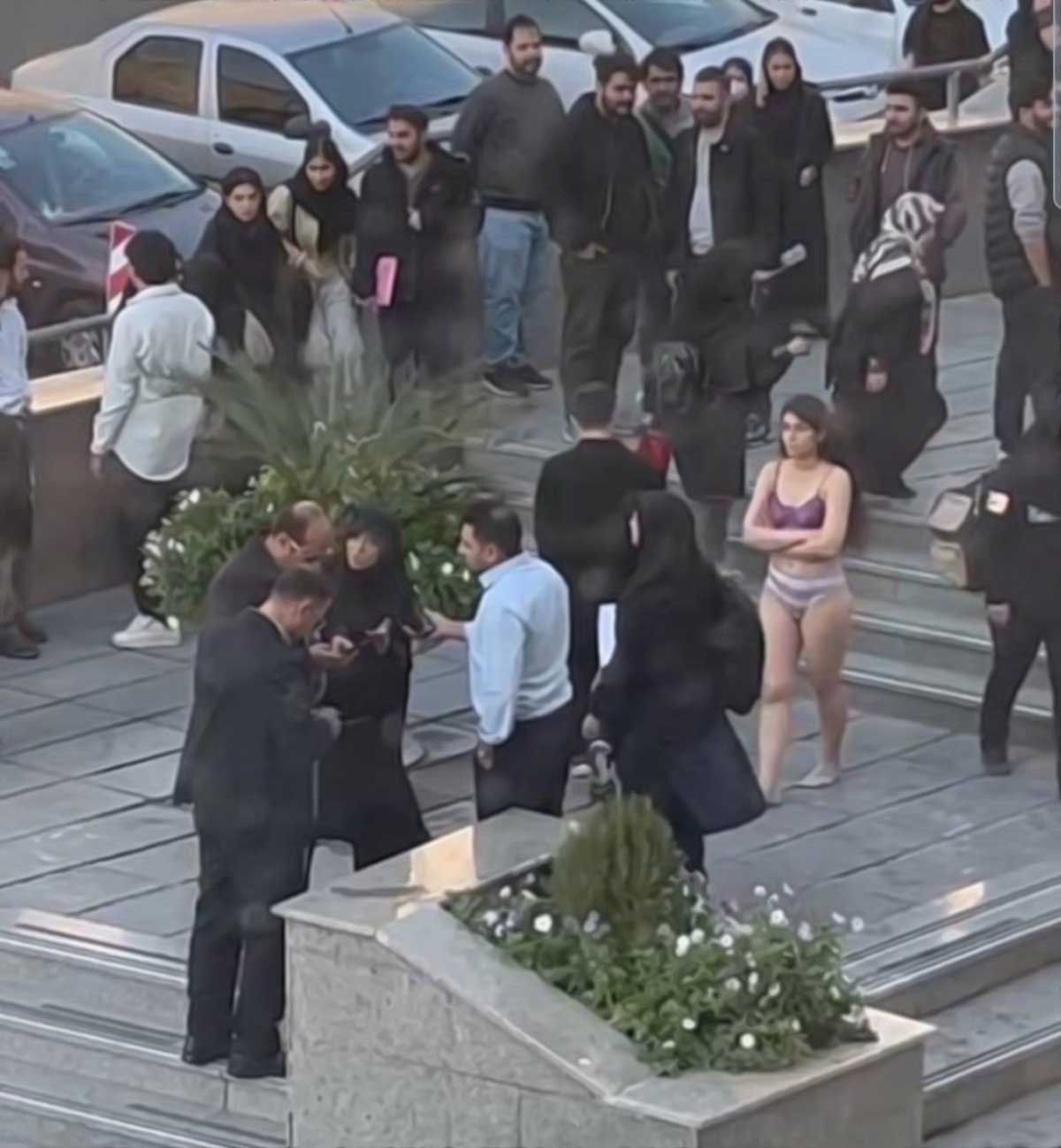 Iranian student strips down outside prestigious Tehran university in bold protest against harassment